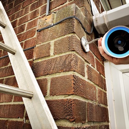 Installing the best smart home cameras on a brick wall